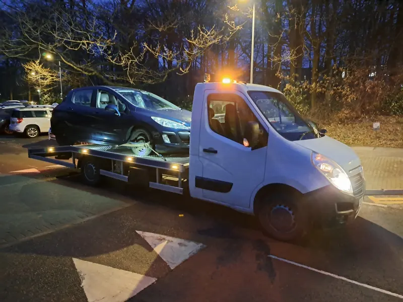 Scrap car bought and loaded onto a recovery truck in Chorley